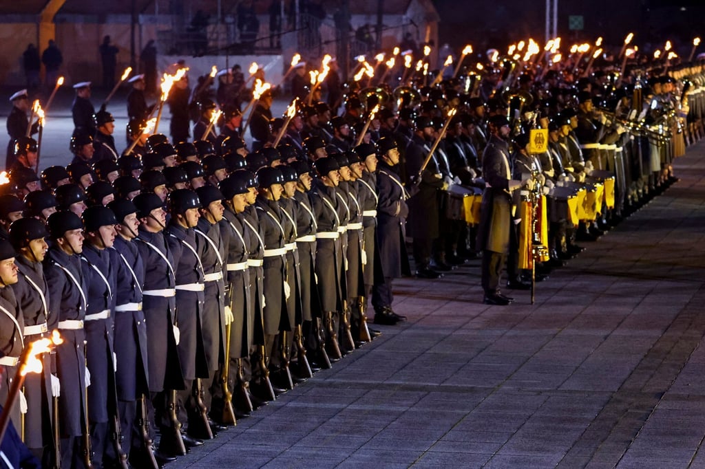 Military band members perform as Germany’s outgoing Chancellor Angela Merkel attends a military grand tattoo in Berlin. Photo: Reuters Military band members perform as Germany’s outgoing Chancellor Angela Merkel attends a military grand tattoo in Berlin. Photo: Reuters
