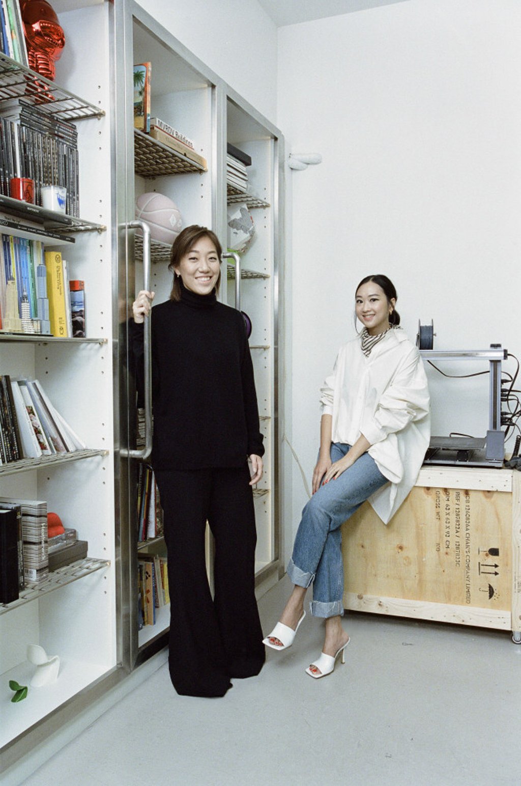 Chak and Chew (right) at their studio in Hong Kong. “She dresses for function, and I for form,” says Chew. Photo: Luke Casey.