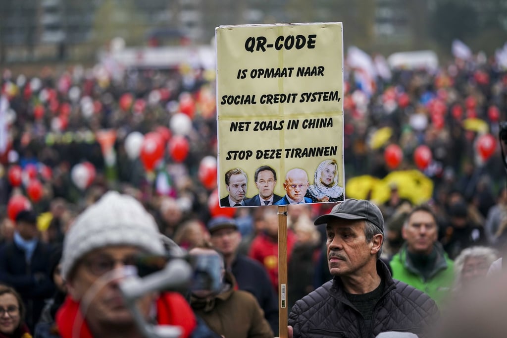 People take part in a protest against coronavirus measures during a march in Utrecht, the Netherlands on Saturday. Photo: EPA-EFE People take part in a protest against coronavirus measures during a march in Utrecht, the Netherlands on Saturday. Photo: EPA-EFE