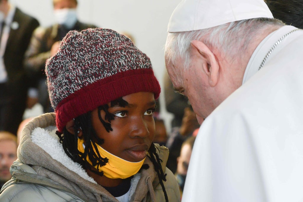 Pope Francis meets a refugee child at the camp on Lesbos, Greece. (Photo: AFP/Vatican Media