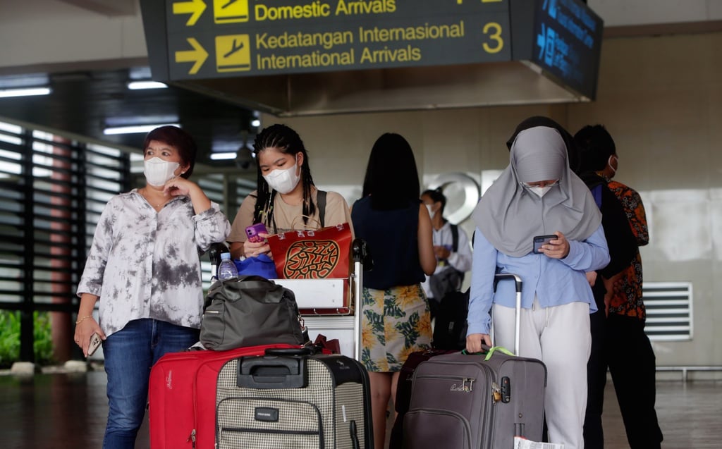 Passengers arrive at an airport in Tangerang, Indonesia. Photo: EPA-EFE