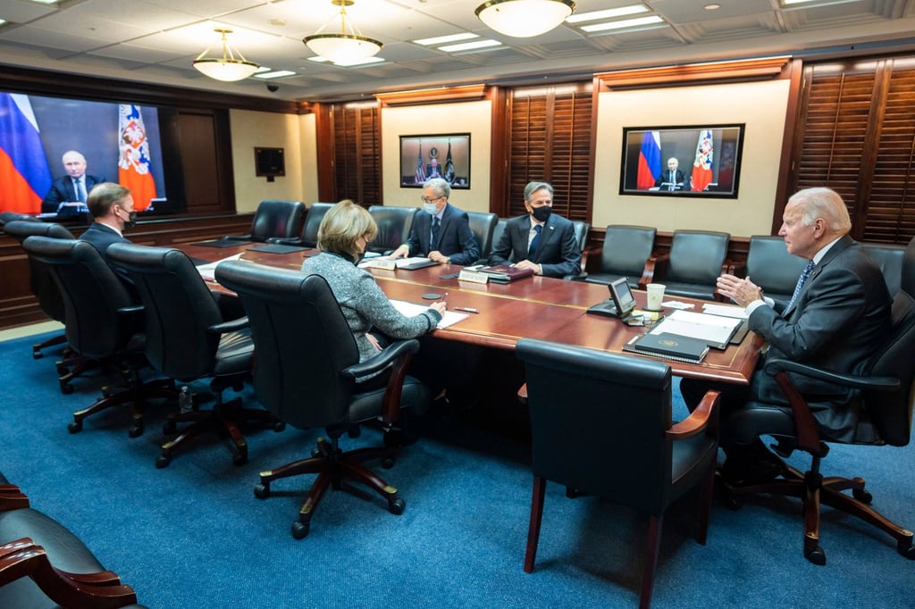 US President Joe Biden (right), with Secretary of State Antony Blinken (second from right) speaks with Russian President Vladimir Putin (on screen) from the White House on Tuesday. Photo: White House via AFP US President Joe Biden (right), with Secretary of State Antony Blinken (second from right) speaks with Russian President Vladimir Putin (on screen) from the White House on Tuesday. Photo: White House via AFP