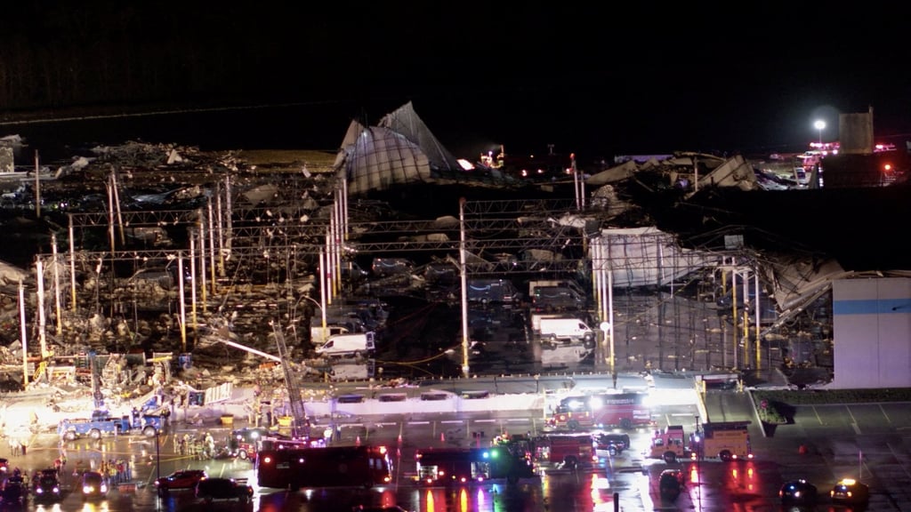 Emergency workers at the scene of a damaged Amazon warehouse in Illinois. Photo: Maverick Media Group, LLC via Reuters