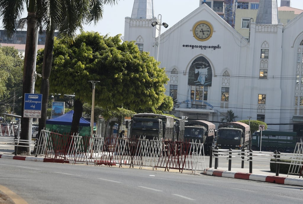 Military trucks are seen parked in front of the Immanuel Baptist Church in central Yangon, Myanmar, on Friday. Photo: EPA