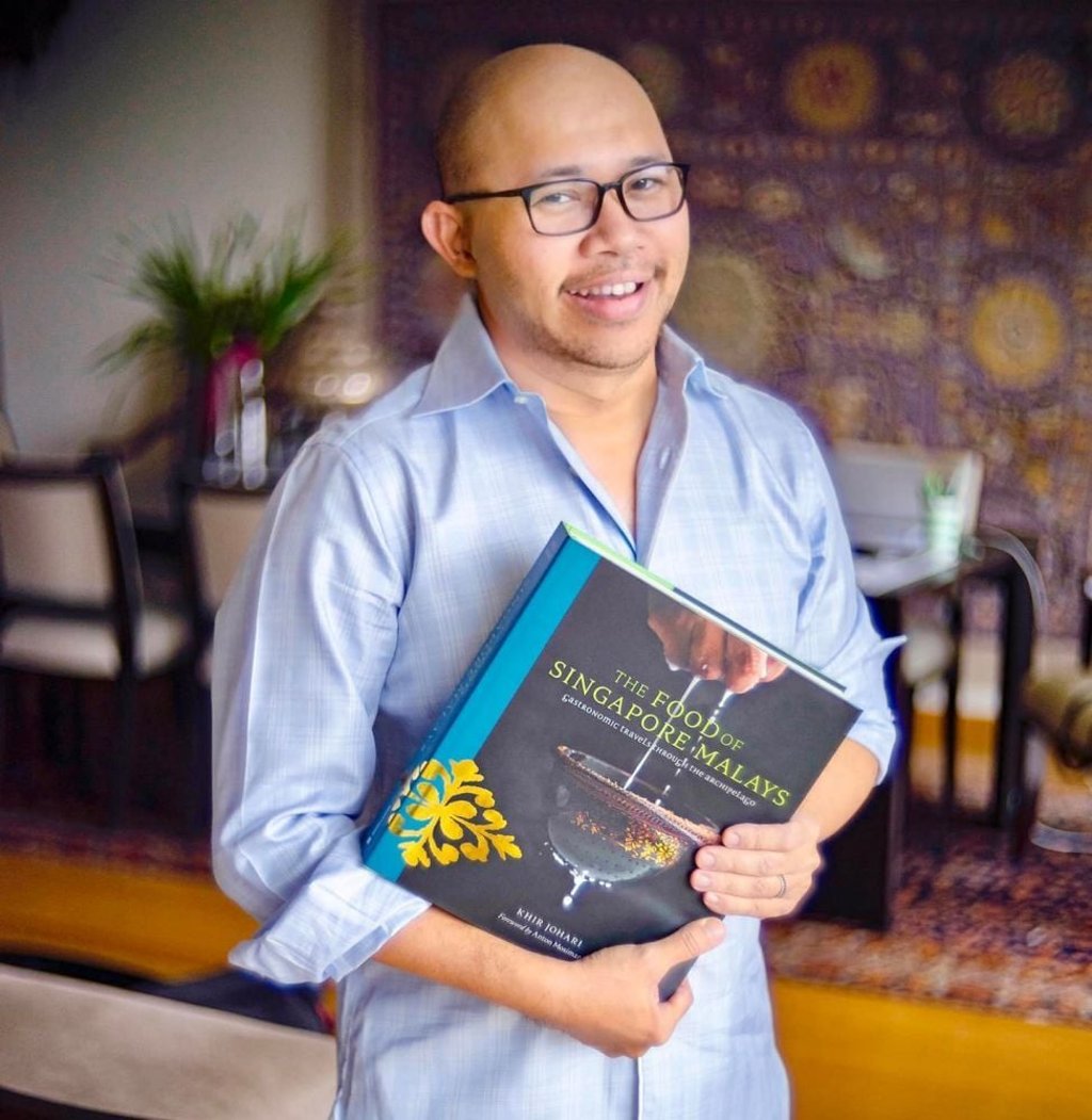 Singaporean historian Khir Johari with his debut book ‘The Food of Singapore Malays: Gastronomic Travels Through The Archipelago’. Photo: Facebook Singaporean historian Khir Johari with his debut book ‘The Food of Singapore Malays: Gastronomic Travels Through The Archipelago’. Photo: Facebook