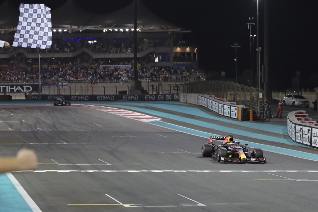 Max Verstappen crosses the finish line to win the 2021 Formula One Grand Prix in Abu Dhabi at Yas Marina Circuit. Photo: EPA Max Verstappen crosses the finish line to win the 2021 Formula One Grand Prix in Abu Dhabi at Yas Marina Circuit. Photo: EPA