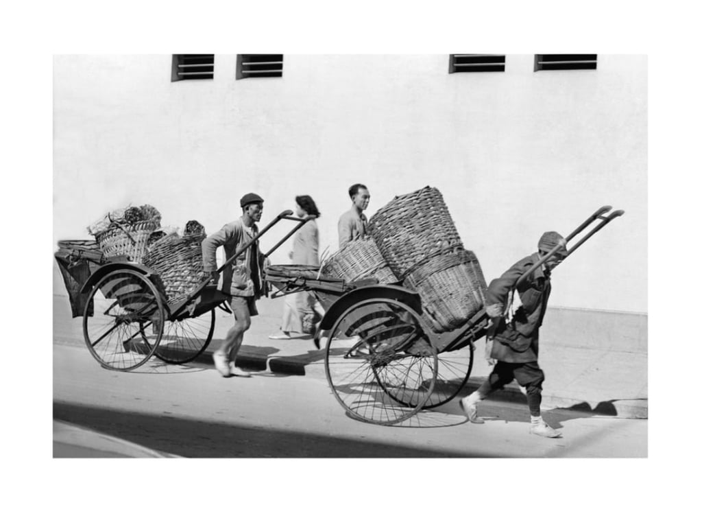 Rickshaw men haul rattan and wicker baskets laden with produce to market. Photo: the estate of Lee Fook Chee Rickshaw men haul rattan and wicker baskets laden with produce to market. Photo: the estate of Lee Fook Chee