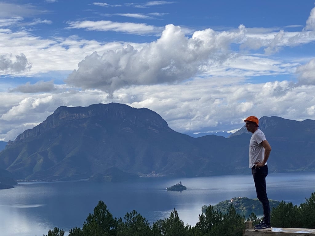 Dominic Johnson-Hill looks out over Lugu Lake in Yunnan during filming of ecology-themed adventure series Seasons of China. Dominic Johnson-Hill looks out over Lugu Lake in Yunnan during filming of ecology-themed adventure series Seasons of China.