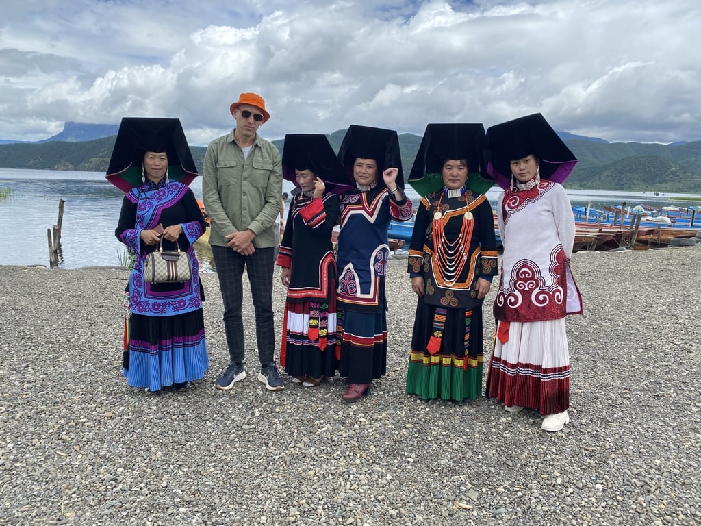 Dominic Johnson-Hill with women in ethnic minority dress at Lugu Lake, Yunnan, during filming of Seasons of China. Photo: Dominic Johnson-Hill Dominic Johnson-Hill with women in ethnic minority dress at Lugu Lake, Yunnan, during filming of Seasons of China. Photo: Dominic Johnson-Hill