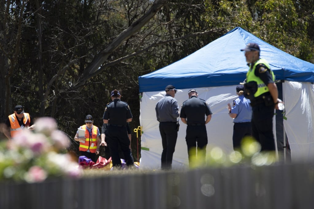 Worksafe Tasmania officers inspect the jumping castle at Hillcrest Primary School in Devonport on Thursday. Photo: EPA-EFE