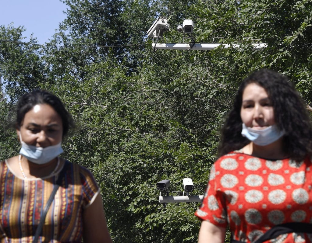 Surveillance cameras behind women in China’s Xinjiang Uygur autonomous region. Photo: Getty Images Surveillance cameras behind women in China’s Xinjiang Uygur autonomous region. Photo: Getty Images