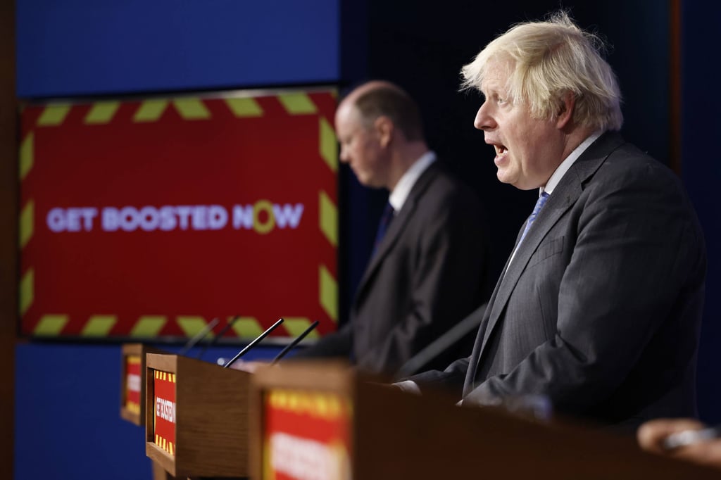 UK Prime Minister Boris Johnson (right) speaks during a media briefing with England’s Chief Medical Officer Chris Whitty at Downing Street on Wednesday. Photo: AP