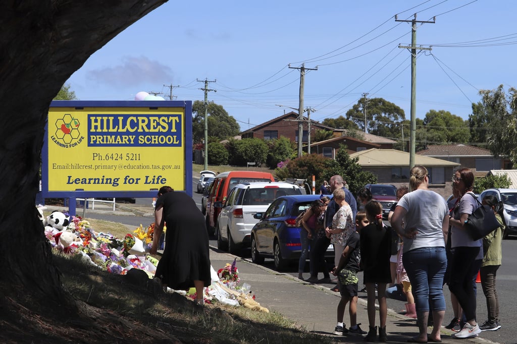 People leave flowers and tributes outside Hillcrest Primary School in Tasmania. Photo: AAP Image via AP