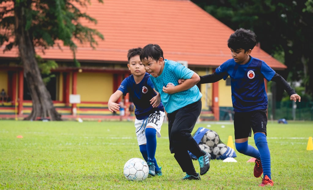 Boys from the Under-8 age group play a mini football match during an ActiveSG academy session at Farrer Park Field. Photo: Natalie Tan