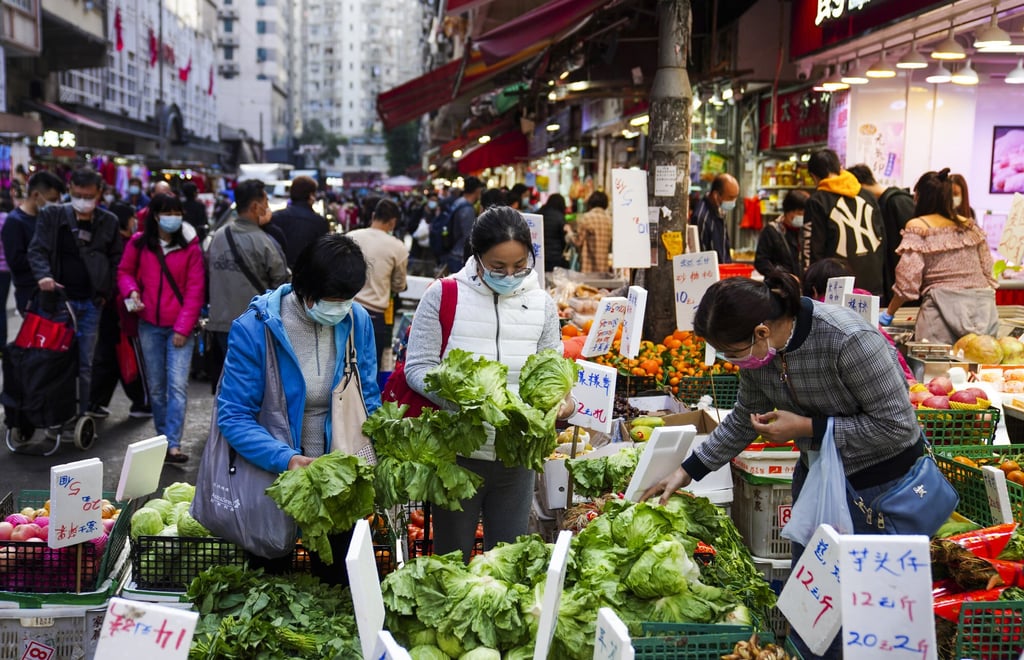 People buy food at the wet market in Chun Yeung Street in North Point, Hong Kong, in preparation of winter solstice dinners with their families. Photo: Sam Tsang