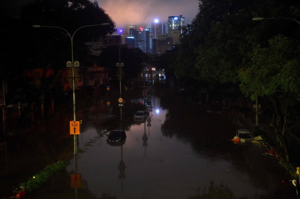 A flooded street after heavy rain in Kuala Lumpur. Photo: AFP A flooded street after heavy rain in Kuala Lumpur. Photo: AFP