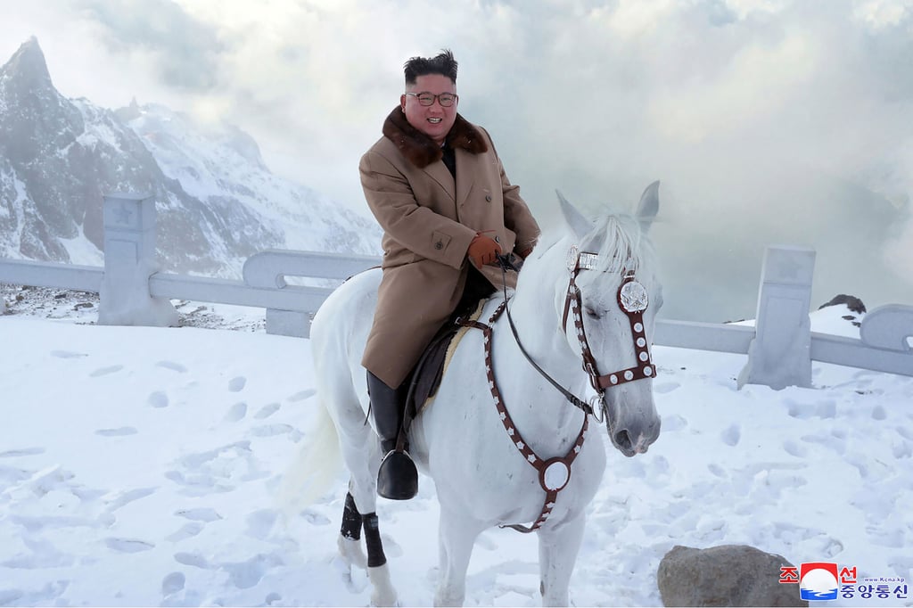 Kim climbs Mount Paektu in North Korea in 2019 wearing a stylish camel coat. Photo: AP Kim climbs Mount Paektu in North Korea in 2019 wearing a stylish camel coat. Photo: AP