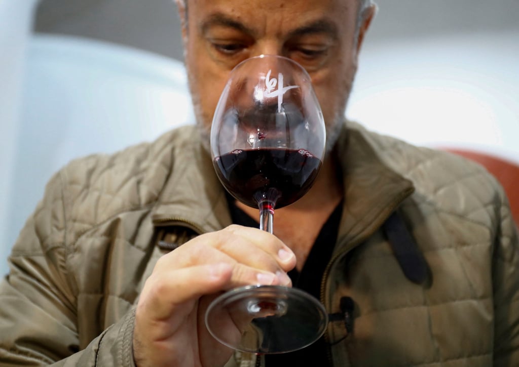 Carlos Lozano, winemaker, enjoying wine with the same name as the Cumbre Vieja volcano in La Palma, Spain. Photo: Reuters