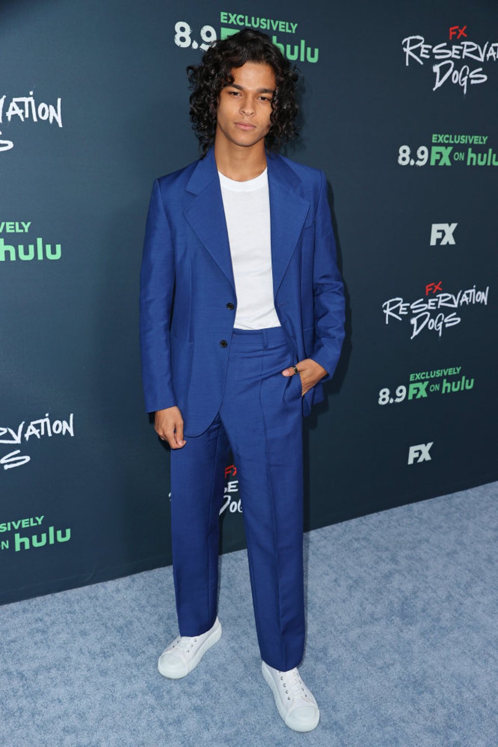 D’Pharaoh Woon-A-Tai in a blue suit at the premiere of Reservation Dogs at NeueHouse Los Angeles, California. Photo: Kevin Winter/Getty Images