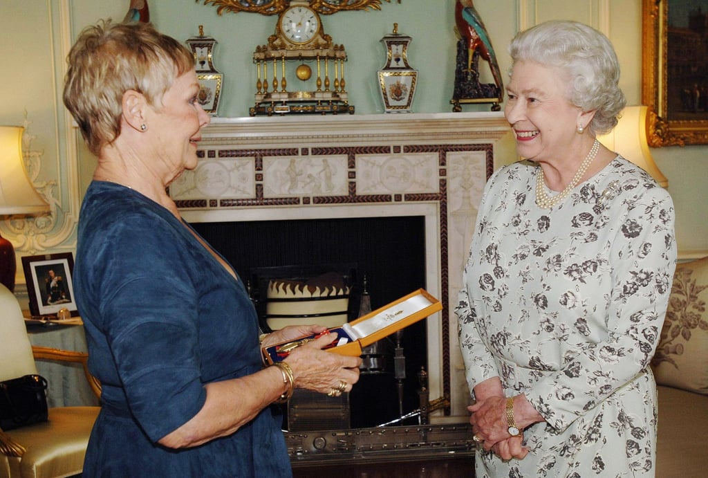 Queen Elizabeth invests Dame Judi Dench with the insignia of a Companion of Honour at Buckingham Palace in 2005. Photo: Corbis via Getty Images Queen Elizabeth invests Dame Judi Dench with the insignia of a Companion of Honour at Buckingham Palace in 2005. Photo: Corbis via Getty Images