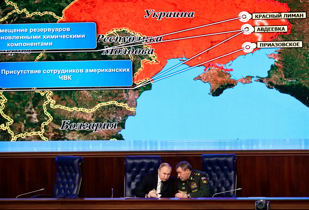 Russian President Vladimir Putin and General Valery Gerasimov at the National Defence Control Centre with a Russian military map showing the alleged deployment of US private military contractors in eastern Ukraine. Photo: AP Russian President Vladimir Putin and General Valery Gerasimov at the National Defence Control Centre with a Russian military map showing the alleged deployment of US private military contractors in eastern Ukraine. Photo: AP