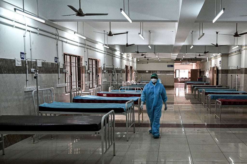 A medical worker medical walks through an isolation ward being prepared for Covid-19 patients at a government hospital in Chennai. Photo: AFP