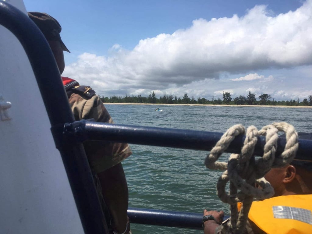 The wreck of the boat that sank off the coast of Madagascar on Monday is pulled towards the beach. Photo: Madagascar Ministry of National Defence via Reuters
