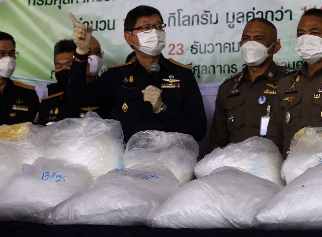 Thai Director-General of Customs, Patchara Anuntasilpa, centre, with the seized drugs. Photo: EPA Thai Director-General of Customs, Patchara Anuntasilpa, centre, with the seized drugs. Photo: EPA