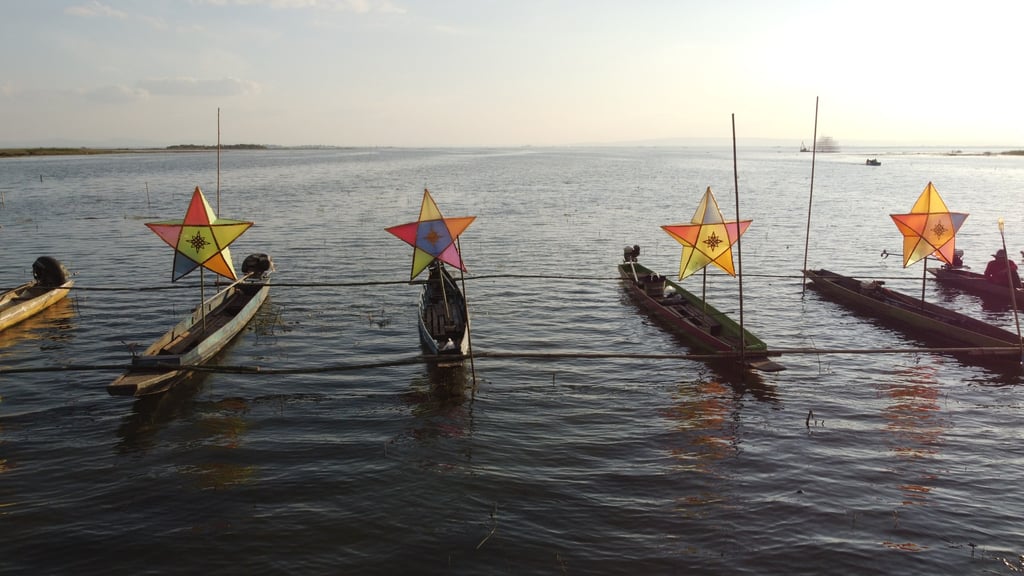 Boats carrying stars for a unique Christmas celebration are seen on Nong Han lake at the Catholic community of Tha Rae in Thailand’s Sakon Nakhon Province. Photo: Vijitra Duangdee