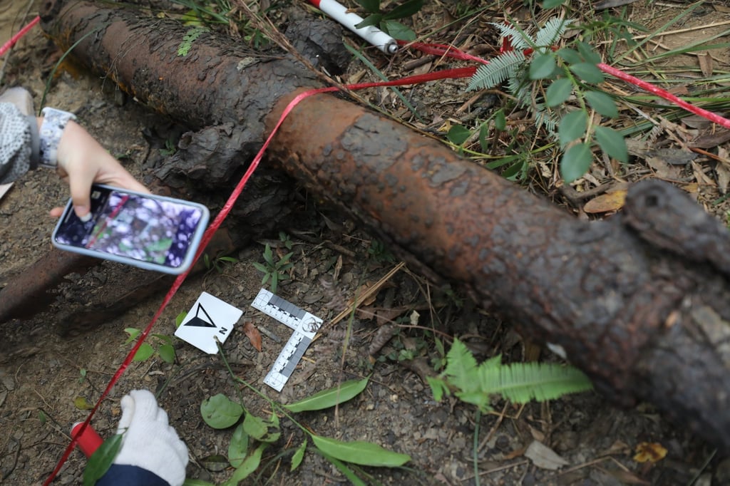 A piece of wreckage is measured at Tai Tam Country Park. Photo: Xiaomei Chen A piece of wreckage is measured at Tai Tam Country Park. Photo: Xiaomei Chen