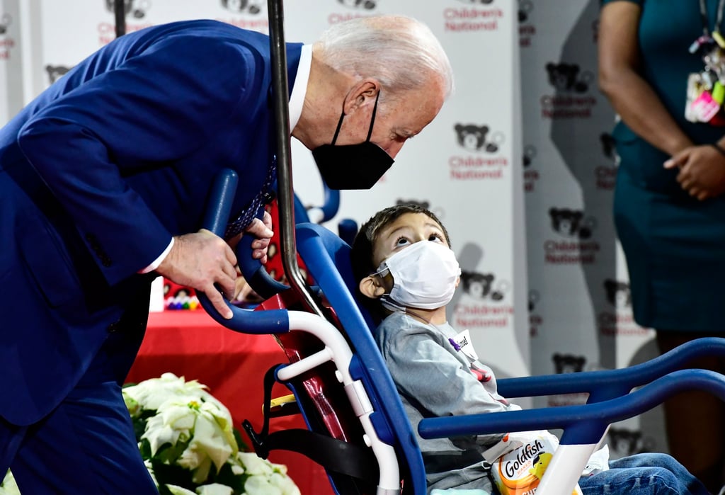 US President Joe Biden talks to a young patient as he looks at craft projects at the Children’s National Medical Centre in Washington on Christmas Eve in Washington. Photo: EPA-EFE