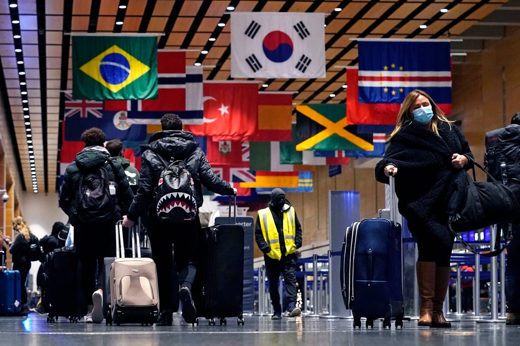 Travellers trek through Terminal E at Logan Airport in Boston on Tuesday. Photo: AP