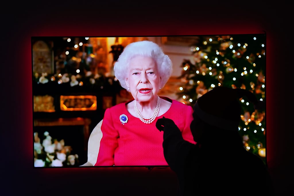 A child is silhouetted on the television screen where Queen Elizabeth is giving her annual Christmas broadcast from Windsor Castle. Photo: dpa A child is silhouetted on the television screen where Queen Elizabeth is giving her annual Christmas broadcast from Windsor Castle. Photo: dpa
