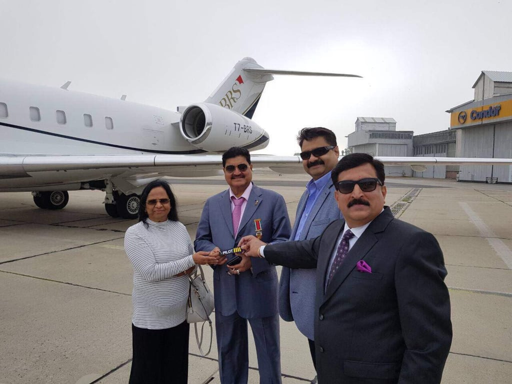 B.R. Shetty with his wife C.R. Shetty in front of their private jet. Photo: Seeandsay.in/Facebook