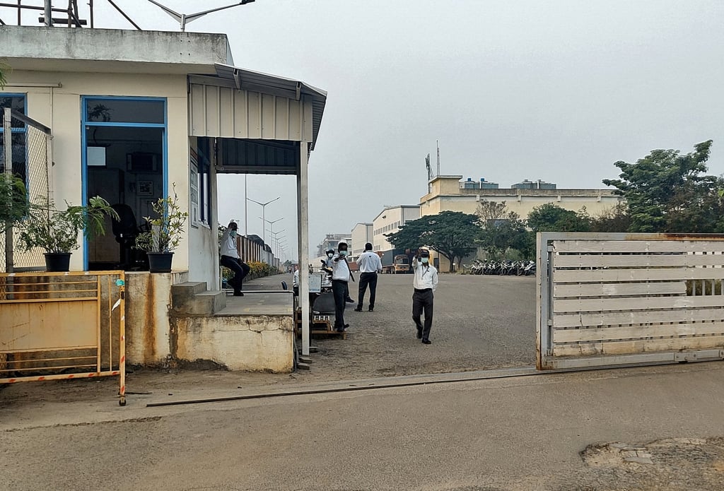Security guards stand at the entrance of Foxconn India’s closed plant in Tamil Nadu Photo: Reuters
