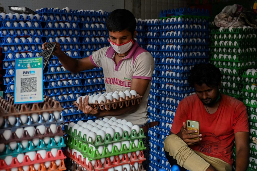 A QR code for Paytm, an Indian digital startup, is displayed in a poultry shop in Mumbai. Photo: AFP A QR code for Paytm, an Indian digital startup, is displayed in a poultry shop in Mumbai. Photo: AFP