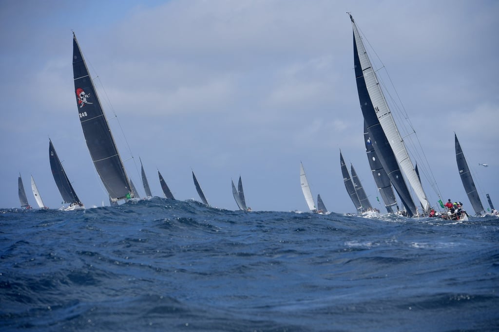 Yachts leave at the start of the 76th Sydney to Hobart race. Photo: dpa