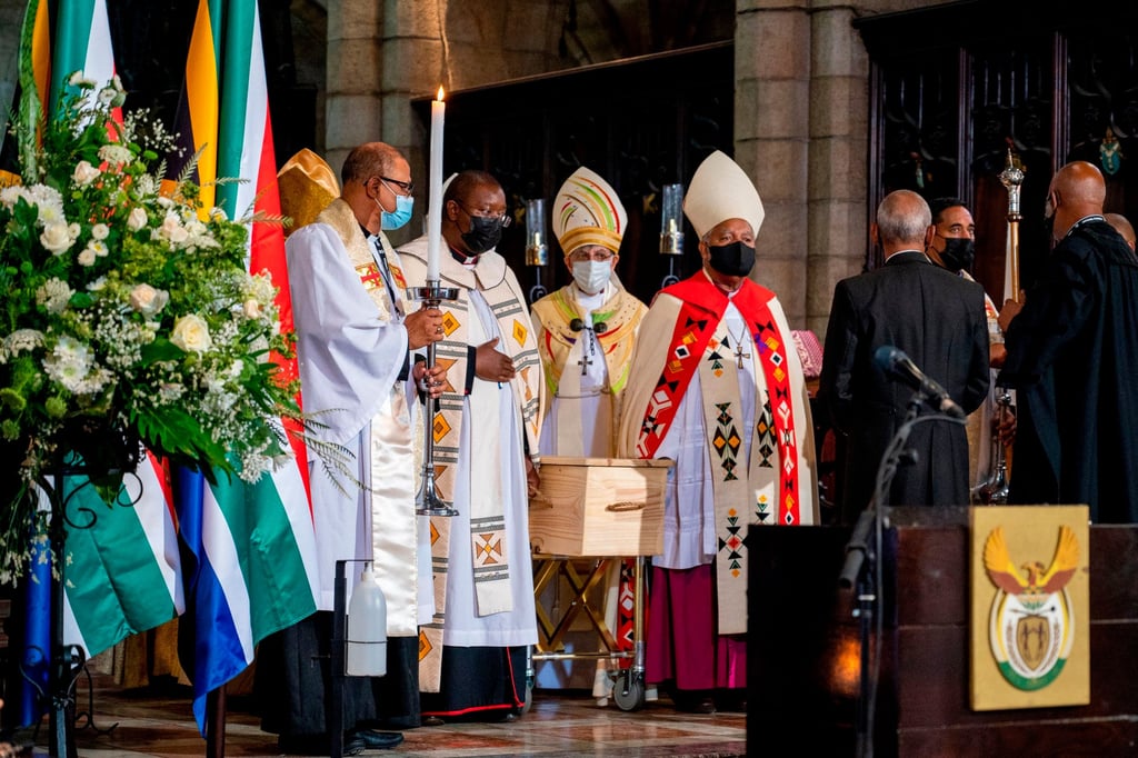 Clerics carry the coffin of Desmond Tutu at St George’s Cathedral in Cape Town, South Africa on Saturday. Photo: AP