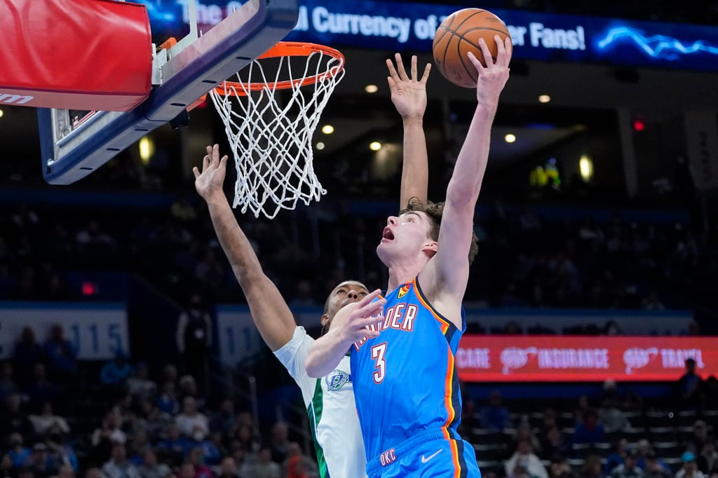 Oklahoma City Thunder guard Josh Giddey (3) goes to the basket in front of Dallas Mavericks centre Moses Brown. Photo: AP