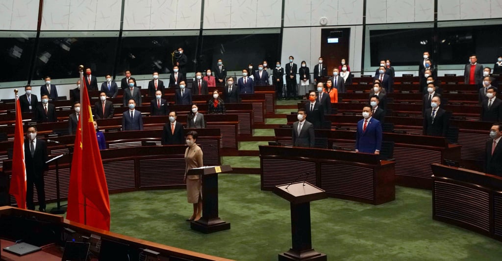 The newly elected lawmakers sing the national anthem. Photo: Felix Wong