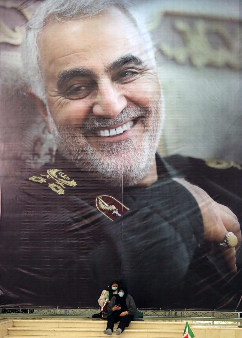An Iranian woman sits under a picture of General Qassem Soleimani at the Mosallah Mosque in Tehran. Photo: EPA-EFE An Iranian woman sits under a picture of General Qassem Soleimani at the Mosallah Mosque in Tehran. Photo: EPA-EFE