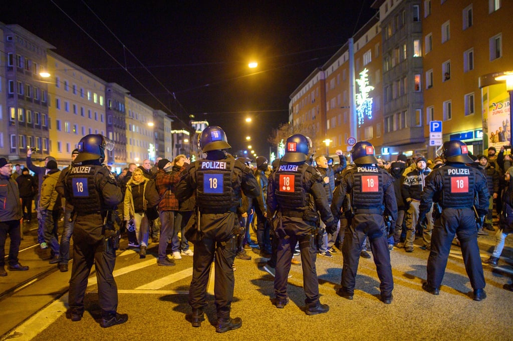 Police officers and protesters in Germany during a demonstration against measures to contain the coronavirus. Photo: dpa