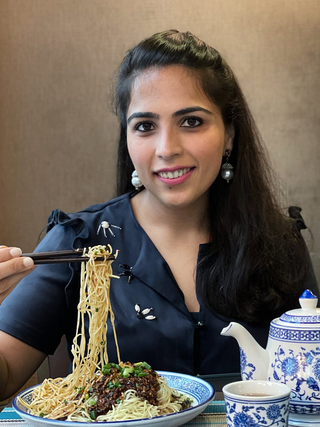 Simran Savlani enjoying Sijie cold noodles. Photo: courtesy of Simran Savlani