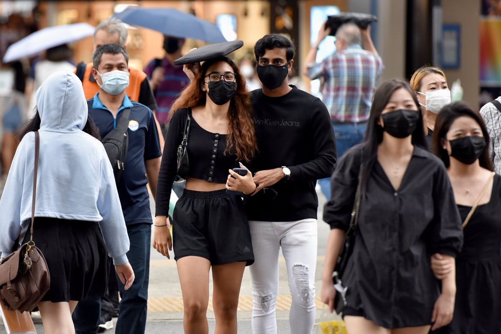 Pedestrians in Singapore. Photo: Reuters
