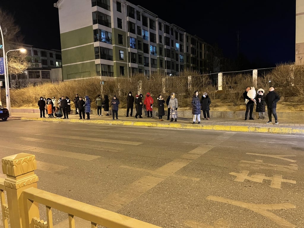 People wait outside to escape the earthquake in Xining. Photo: Xinhua People wait outside to escape the earthquake in Xining. Photo: Xinhua
