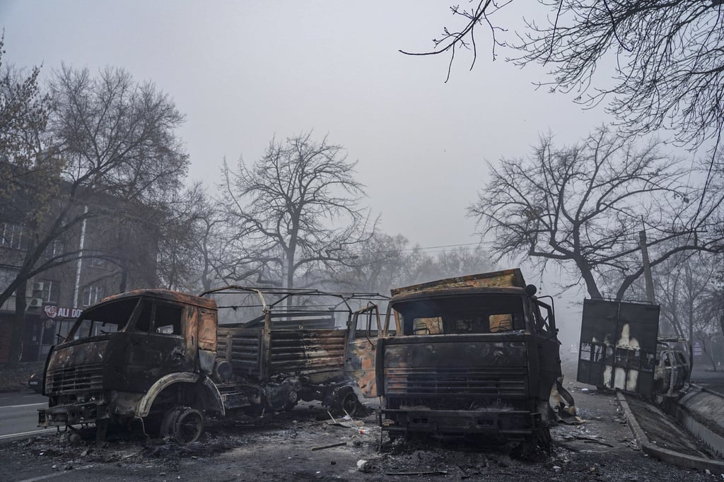 Burnt-out military vehicles are seen on the street in Almaty on January 6. Photo: EPA Burnt-out military vehicles are seen on the street in Almaty on January 6. Photo: EPA