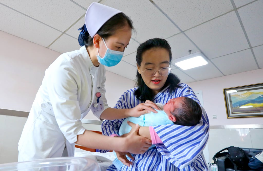 China last year relaxed its birth controls further by allowing families to have up to three children. Photo: Getty China last year relaxed its birth controls further by allowing families to have up to three children. Photo: Getty
