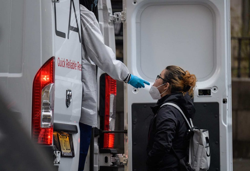 A person receives a Covid-19 test out of a mobile testing van in New York on January 5. Photo: AFP