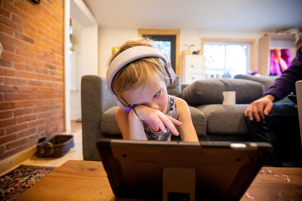 Six-year-old Willa Stief attends an online class while her parents work from home and take care of a toddler amid surging Covid-19 cases in Hamilton, Ontario, Canada on January 7. Photo: Reuters