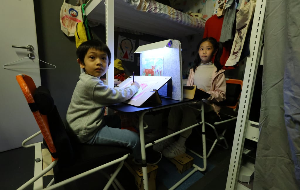 Users demonstrate a mock-up of the environment. Hong Kong’s notorious subdivided flats provide little space for inhabitants, especially children, to play or study. Photo: Dickson Lee